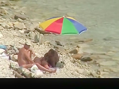 Nudist man fucking nude woman in beach
