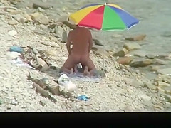 Nudist man fucking nude woman in beach