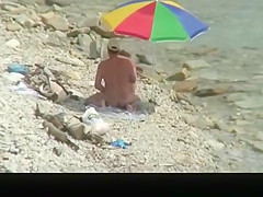 Nudist man fucking nude woman in beach