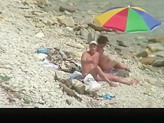 Nudist man fucking nude woman in beach