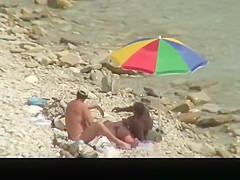 Nudist man fucking nude woman in beach
