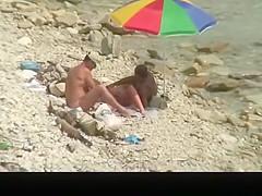Nudist man fucking nude woman in beach