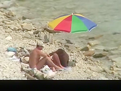 Nudist man fucking nude woman in beach