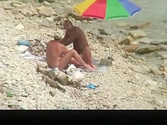 Nudist man fucking nude woman in beach