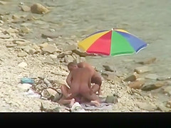 Nudist man fucking nude woman in beach