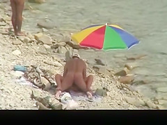Nudist man fucking nude woman in beach