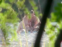 Nudist couple fucking in the beach