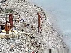 Nudist couple fucking in the water and shore