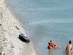 Nudist couple fucking in the water and shore