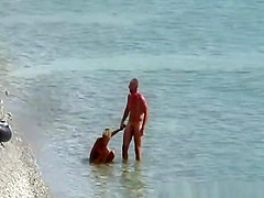 Nudist couple fucking in the water and shore