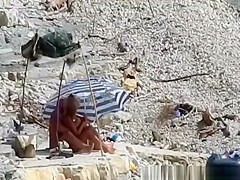 Nudist couple fucking in the water and shore