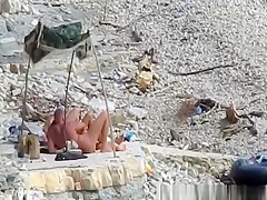 Nudist couple fucking in the water and shore