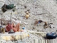 Nudist couple fucking in the water and shore