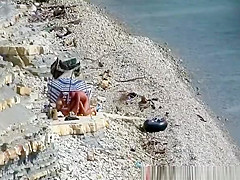 Nudist couple fucking in the water and shore