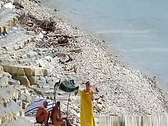Nudist couple fucking in the water and shore