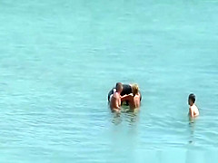 Nudist couple fucking in the water and shore
