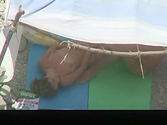 Nudist couple caught fucking under tent