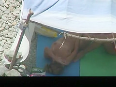 Nudist couple caught fucking under tent