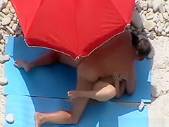 Guy strokes and couple fucks in beach