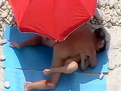 Guy strokes and couple fucks in beach