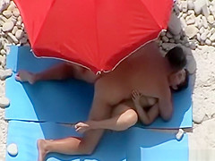 Guy strokes and couple fucks in beach