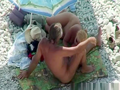 Blonde nudist plays with dick