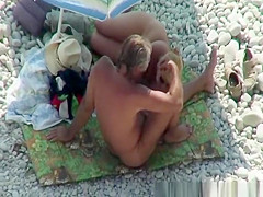 Blonde nudist plays with dick