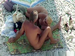Blonde nudist plays with dick
