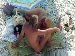 Blonde nudist plays with dick