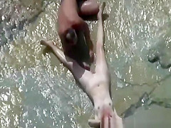 Nudist couple caught fucking in water