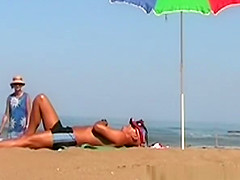 Wife handjob at beach