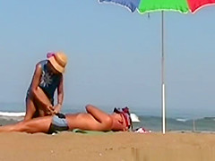 Wife handjob at beach
