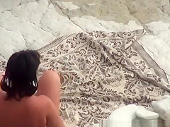 Two nude men fuck nudist at beach