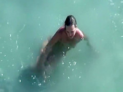 Nudists film their threesome at beach