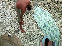 Nudists film their threesome at beach