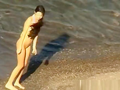 A man and his hot wife at the beach