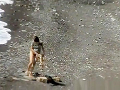 A man and his hot wife at the beach