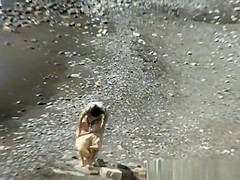 A man and his hot wife at the beach
