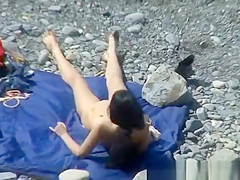 A man and his hot wife at the beach