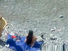 A man and his hot wife at the beach