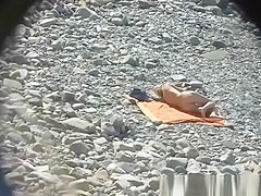 Couple hangs out on the beach