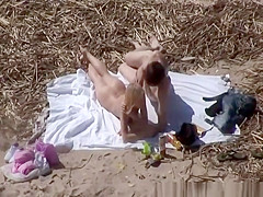 Beach nudist blowjob with couple watching