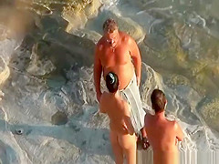 Nudist couple handjob and pussy eating