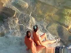 Nudist couple handjob and pussy eating