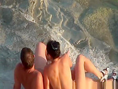 Nudist couple handjob and pussy eating