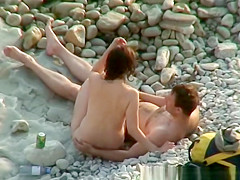 Nudist woman posing for her man taking pictures