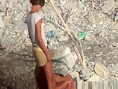 Wife strokes his man dick in beach