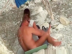 Wife strokes his man dick in beach