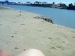 Kinky couple filming their beach fuck