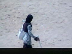 Couple spied in the beach fucking under the sun umbrella